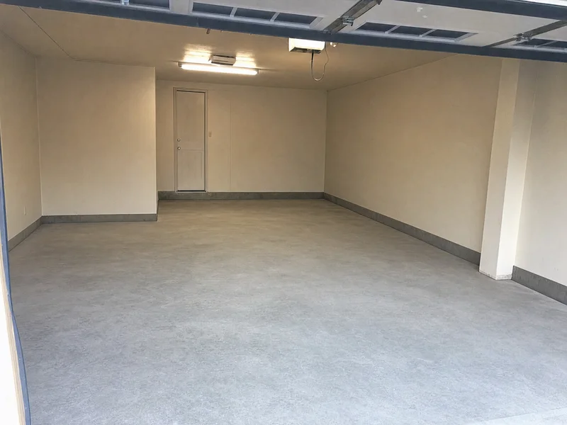 The same garage emptied and swept clean, the after photo